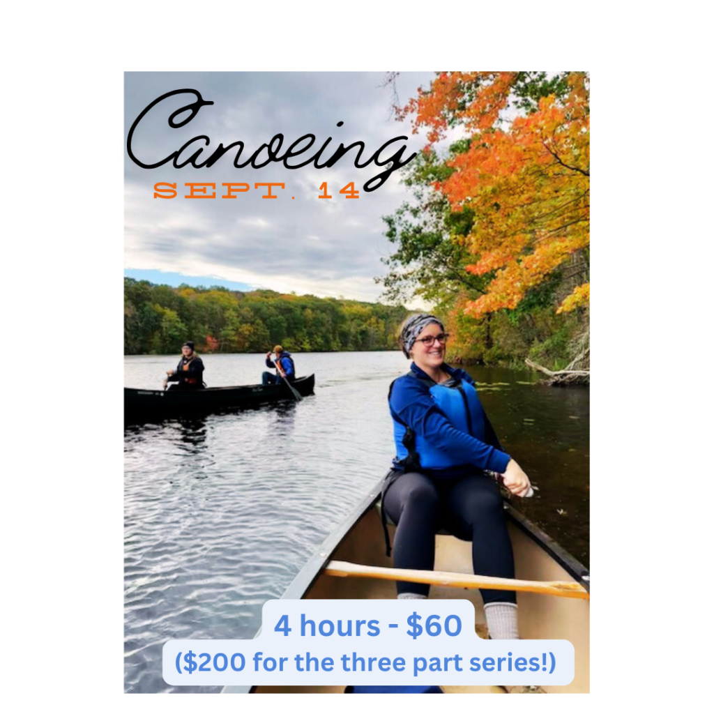 Women canoeing in a lake in fall